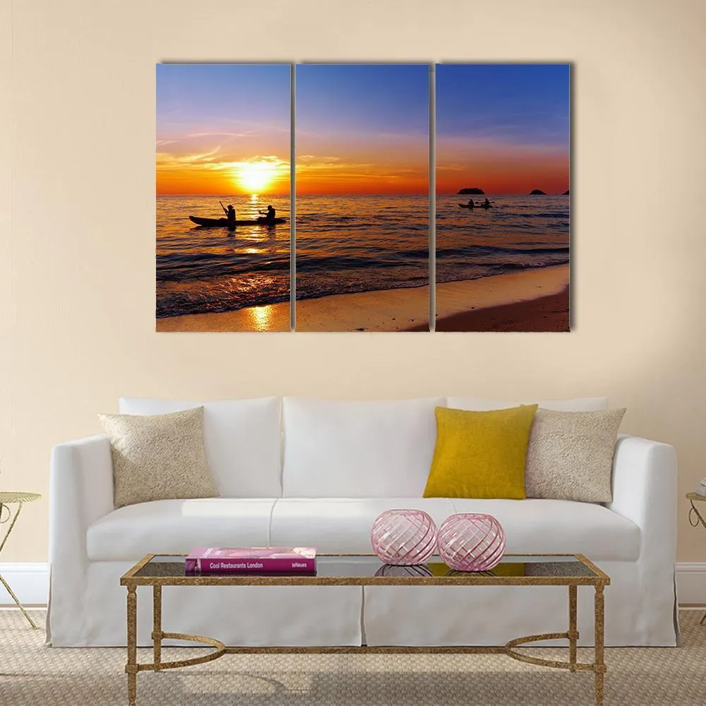 Kayakers At Sunset Canvas Wall Art