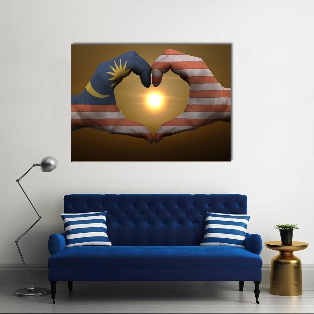 Malaysia Flag On Hands Canvas Wall Art